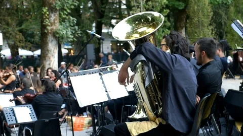 Symphony orchestra playing outdoor Stock Footage
