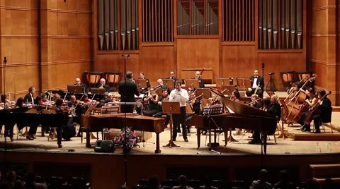 Symphony Orchestra plays with a flute excerpt from the opera view Stock-Footage 54911588