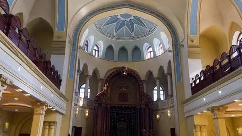 The synagogue building is inside. A two-tiered hall with domes and windows. Fotos de archivo