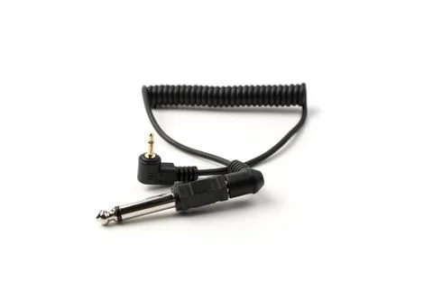 The sync cable with the connector and plug is isolated on a white background. Stock Photos