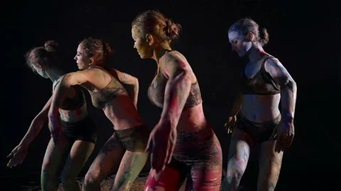 Synchronic dance of four female dancers, women are dancing in darkness, bodies 스톡 동영상 168123778