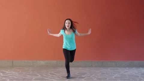 Synchronism, coordination-girl performs a synchronized modern dance choreography Stock Footage 153628055