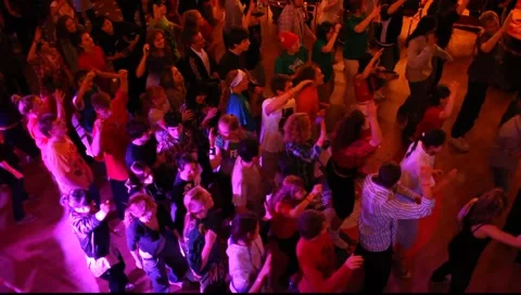 Synchronized dancing crowd of young people in a nightclub Stock Footage 986473
