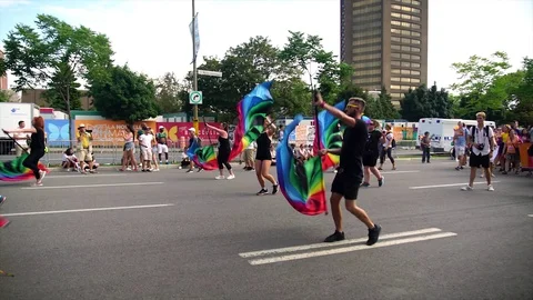 Synchronized flag choregraphy during Montreal gay pride Stock Footage 114346680
