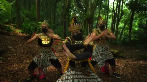 Synchronized Javanese Dance Trio Performing in Sunlight Forest Stock-Footage 276348317