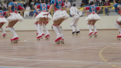 Synchronized roller skating team performing indoors Stock Footage 324755830