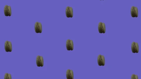 Synchronized Spinning Macarons on Color-Changing Background 2 库存影片 112882763