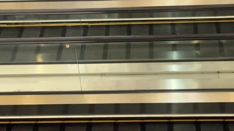 Synchronized Transit Flow: Metallic and Glass Escalator Dynamics in a Multi.. Video stock 337286325