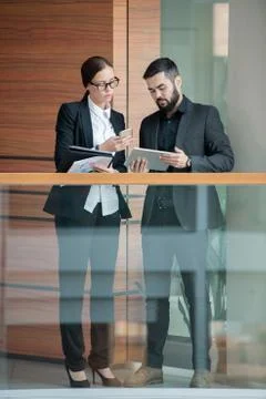 Synchronizing devices in office Stock Photos