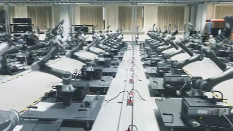 Synchronous setting of a large number of industrial robots. Dance of robots. Stock-Footage 116347232