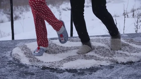 Synchronously Dancing Feet in the Snow Stock Footage 144637314