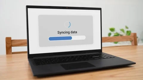Syncing laptop data with cloud storage backup. Concept of online network. Video stock 310296224