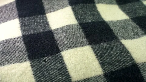 Synthetic material, checked black and white blanket Stock Footage 345864762