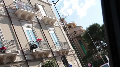 Syracuse sicily italy building next on street road shot from driving moving car Stock Footage 252154561