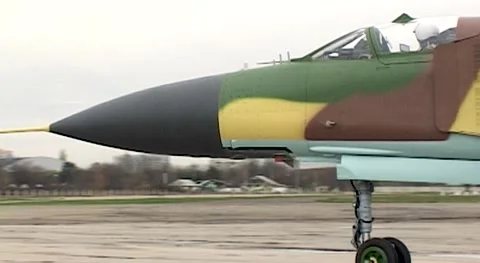 Syrian Air Force. Fighter MiG-23 (NATO: Flogger) is taxiing along taxiway. Stock Footage 142008336