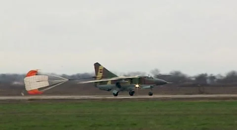Syrian Air Force. Fighter MiG-23 (Flogger) on runways with braking parachute. Stock Footage 142008368
