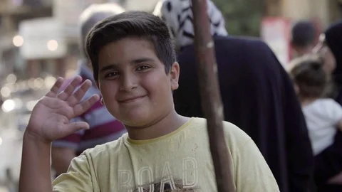 Syrian boy waves his hand towards camera in Bloudan, Syria Stock Footage 121808695