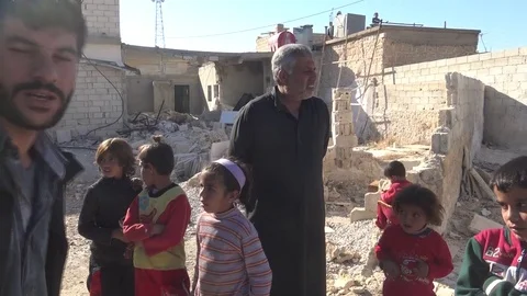 Syrian children in front of a building destroyed by ISIS 2016 스톡 동영상 70068095