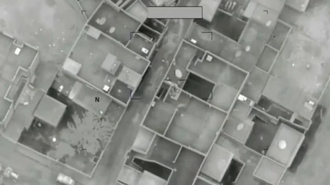 Syrian Forces bomb ISIS compound in Raqqah, Syria Stock Footage 94566912