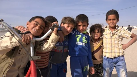 Syrian refugee kids play with the camera in Zaatari camp in Jordan Video stock 71531053