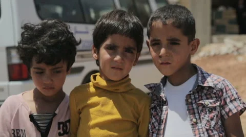 Syrian war refugee siblings standing next to each other Stock Footage 64362117
