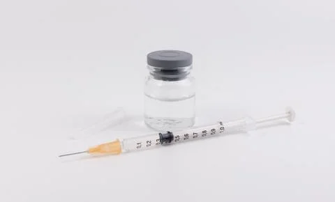 Syringe and bottle Stock Photos
