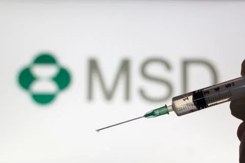 Syringe and MSD logo on the background. Coronavirus, Covid-19 vaccine concept Stock Photos