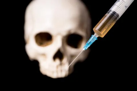 Syringe and skull Stock Photos