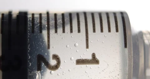 Syringe in Close-up with Clear Liquid Stock Footage 284209489