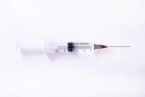 Syringe close up on a white background Stock Photos