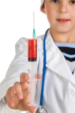 Syringe closeup full of liquid in the doctor's hand Stock Photos