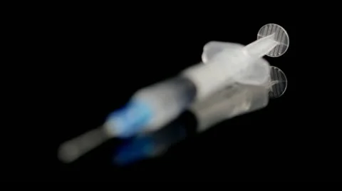 Syringe comes into focus Stock Footage 12621282