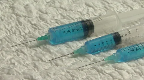 Syringe dispaly closeup Stock Footage