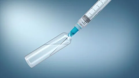 Syringe draws liquid medication from a vial, Stock Footage 345200195
