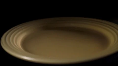Syringe falling in plate in slow motion Stock Footage 81231268