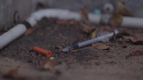 Syringe on the ground Stock Footage 271430659