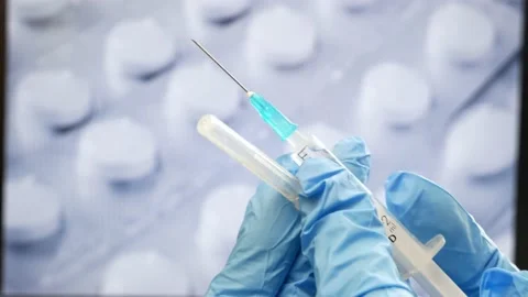 Syringe in hand and many different pills in blister pack, drugs and capsule.. 스톡 동영상 232610676