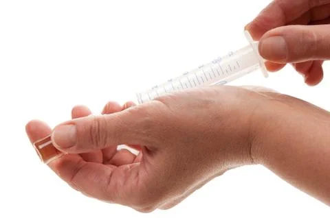 Syringe in hand Foto stock