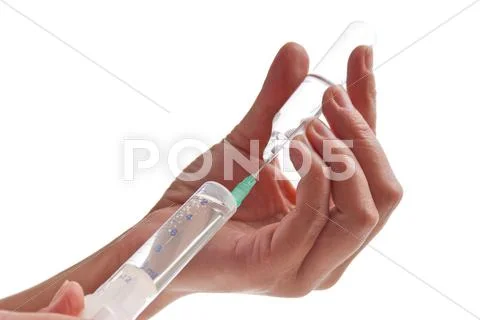 Syringe in hand Stock Photos