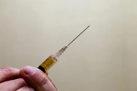 Syringe in a hand Stock Photos