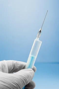 Syringe in the hand Stock Photos