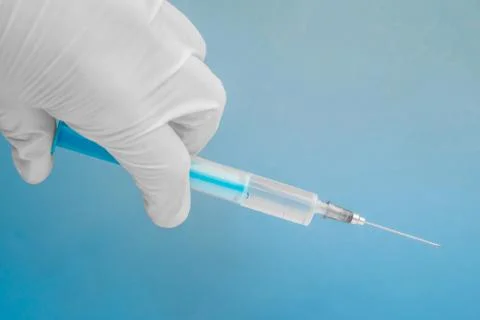 Syringe in the hand Stock Photos