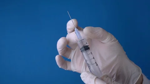 Syringe injection preparation Stock Footage 128798003