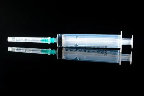 Syringe for injections with reflection Stock Photos