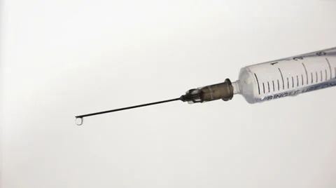 Syringe injector needle drops - HD Stock Footage 40472861