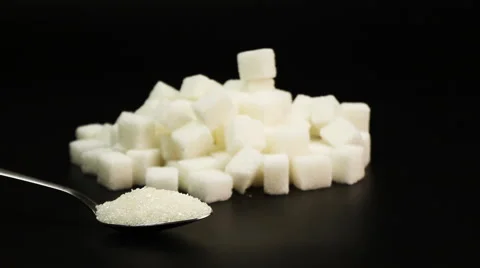 Syringe of insulin putting in pile of sugar next to sugar cubes, diabetes Stock Footage 66482853