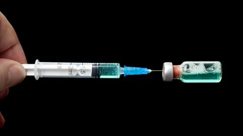 Syringe isolated on black background Stock Photos