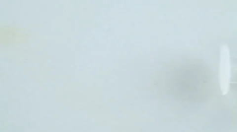 A syringe lying on a white table Stock-Footage 58878638