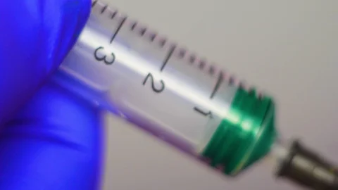 Syringe making injection. Close-up. Stock Footage 106861203