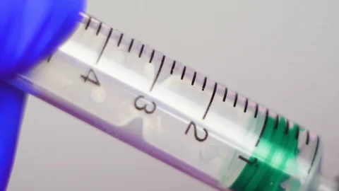 Syringe making injection. Close-up. Stock Footage 106861345